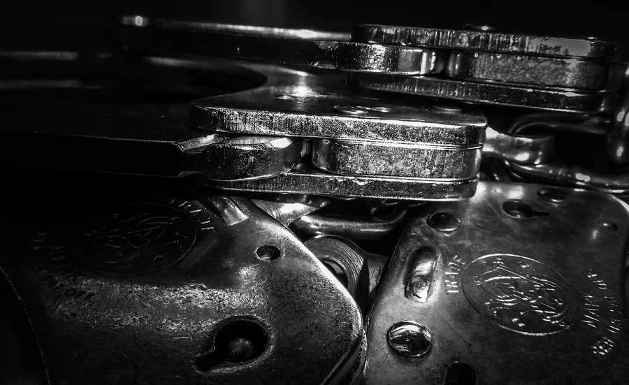 handcuffs, jail, prison, crime, criminal, justice, constraint, cuff, freedom, investigation, liberation, police, cuffs, handcuff, criminal justice, law enforcement, corrections, penology, law, metal, captive, captured, arrested, prisoner, inmate, detained, fort myers, florida, gray police, gray law, gray prison, gray metal