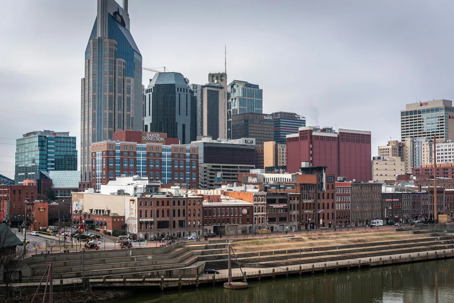 Capture of the Nashville skyline featuring iconic buildings along the Cumberland River.