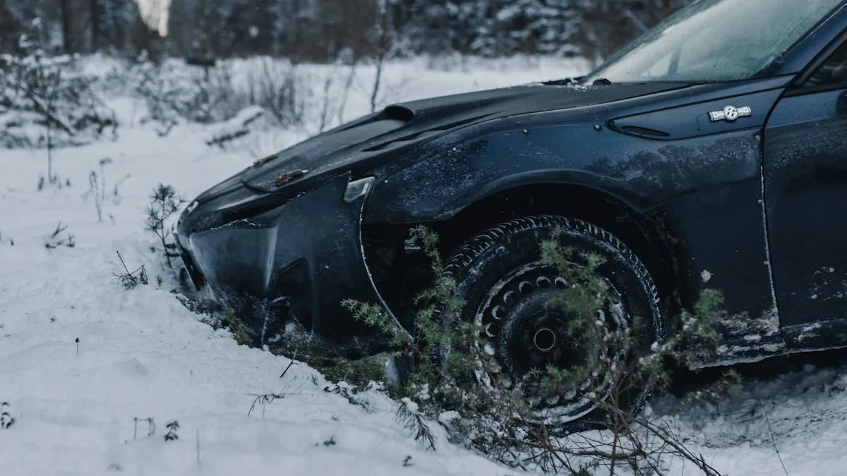 A damaged car sits abandoned in a snowy rural winter setting.
