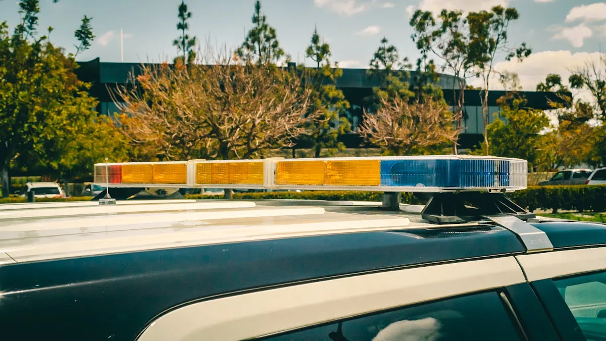Close-up of a police car's emergency lights with urban background.