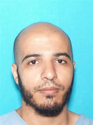 Registry photo of Midian Abass Al-Kubbechy