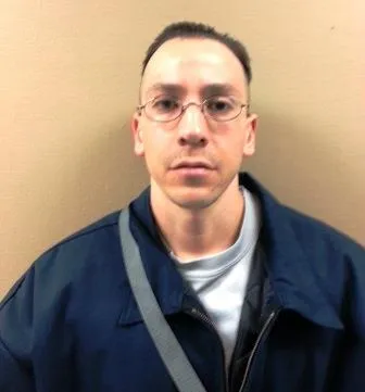 Registry photo of Johnny Mario Foster