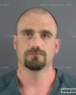 Booking photo of Travis Michael Elliott, Anderson County, Oct 10, 2013